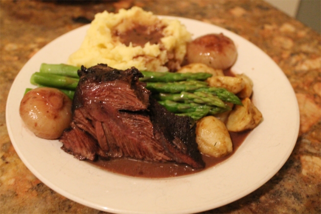Braised Beef Cheeks served with Steamed Asparagus, Oven Roasted Jerusalem Artichokes, Braised Pearl Onions, Mashed Potatoes, and a Red Wine Reduction